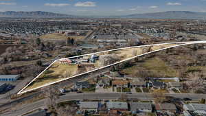 View of property location featuring a mountain backdrop, property boundaries highlighted, and nearby suburban area