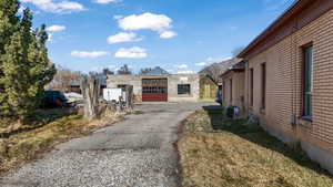 View of property exterior with brick siding