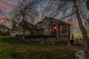 View of front of house with mature trees