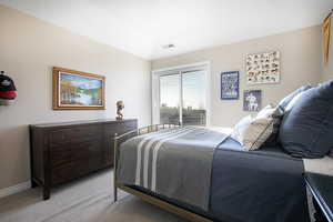Bedroom with baseboards and carpet flooring