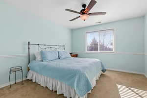 2nd bedroom with a ceiling fan and carpet