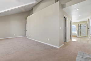 Large master bedroom featuring light colored carpet and recessed lighting