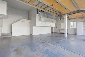 View of 3 car garage with extra storage