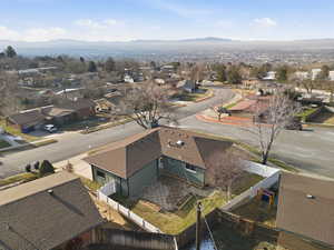 Aerial perspective of suburban area featuring a mountain backdrop