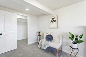 Sitting room featuring carpet flooring and recessed lighting