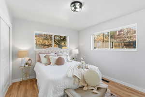 Bedroom featuring a closet and light wood-style flooring