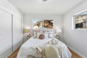Bedroom featuring a closet and wood finished floors