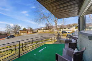 View of patio with a residential view and a mountain view