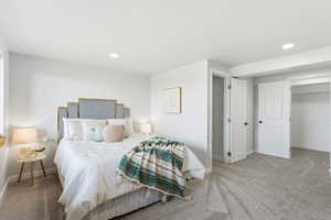 Bedroom with carpet floors and recessed lighting