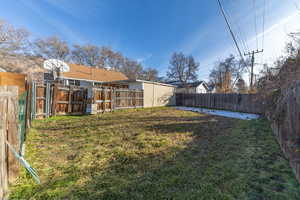 Fenced backyard with a shed