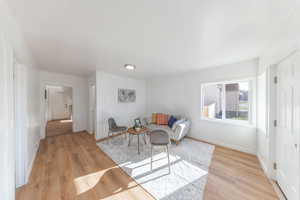 Living area with light wood finished floors