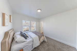 Carpeted bedroom with baseboards