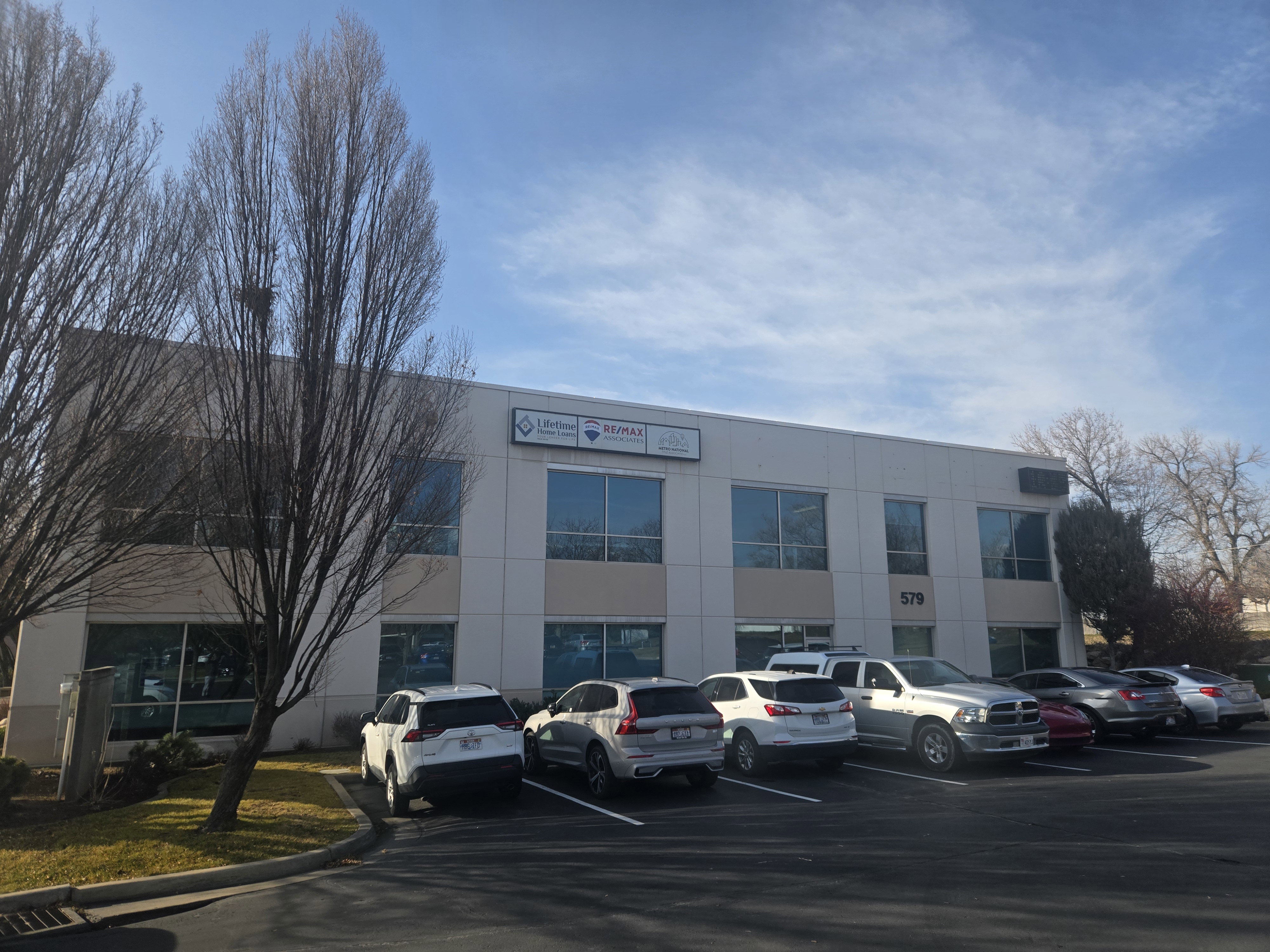 View of commercial location with uncovered parking