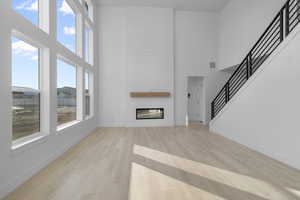 FIREPLACE W/ 2 STORY CEILINGS & WALL OF WINDOWS!