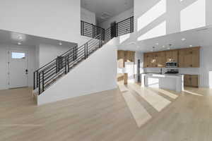 OPEN LIVING CONCEPT W/ 2 STORY OPENING TO UPSTAIRS!