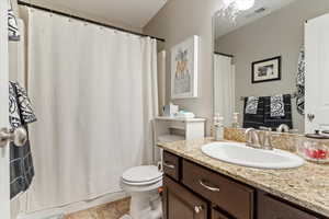 Full bath featuring vanity and shower / tub combo