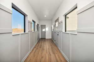 Corridor featuring light wood-style floors