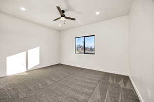 Carpeted spare room featuring recessed lighting and ceiling fan