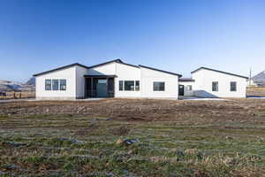 Rear view of house with a mountain view