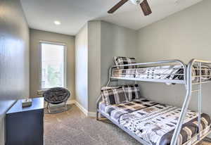 Bedroom with carpet and a ceiling fan