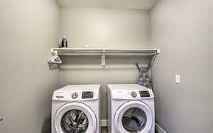 Washroom featuring washer and dryer