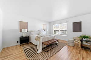 Bedroom with baseboards and light wood-style flooring