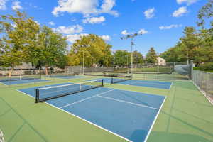 View of tennis court featuring community basketball court