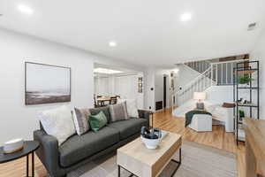 Living area featuring light wood finished floors and stairs