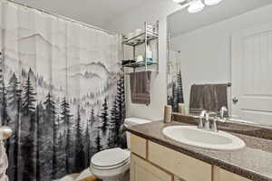 Full bath with vanity and shower / bath combo