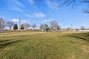 View of home's community featuring a gazebo and a lawn