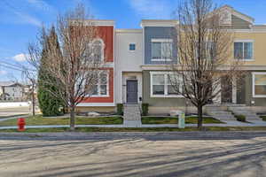 View of front of home featuring stucco siding and entry steps