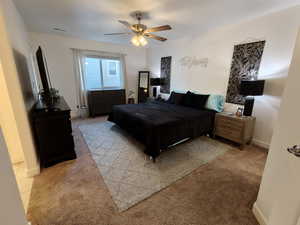 Bedroom with carpet flooring and ceiling fan