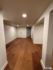 Finished basement featuring wood finished floors and recessed lighting