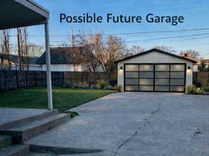 View of yard with an outdoor structure and a garage