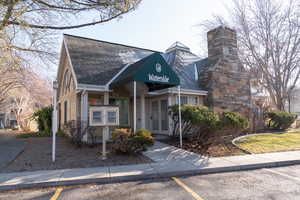 Front of the clubhouse with a small community library on the exterior.