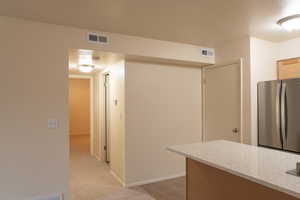 Convenience in the floor plan, looking toward one of two bedrooms.