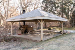 Pavilion, fireplace, grill and picnic area.