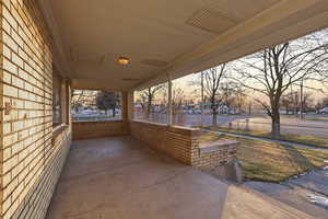 Patio terrace at dusk with a porch
