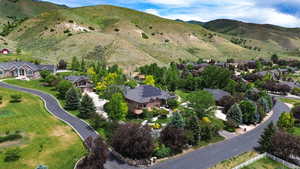 Aerial view of residential area featuring mountains