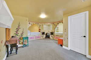 Rec room featuring carpet and baseboards