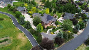 Aerial overview of property's location featuring nearby suburban area