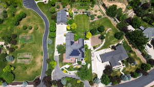 Aerial view of property's location with nearby suburban area