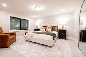 Bedroom with carpet floors and recessed lighting