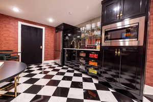 Kitchenette featuring stainless steel appliances, sink and recessed lighting