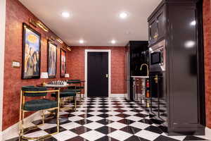 Kitchenette featuring stainless steel appliances, sink and recessed lighting