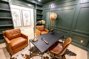 Office with a decorative board and batten walls