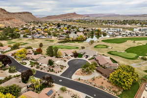 Aerial view of property and surrounding area with nearby suburban area and a water and mountain view