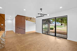 Unfurnished living room with golf course view, recessed lighting, and light wood finished floors