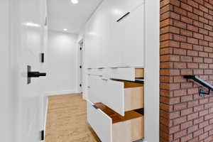 Hallway featuring recessed lighting and light wood finished floors