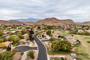 Aerial perspective of suburban area with a mountainous background